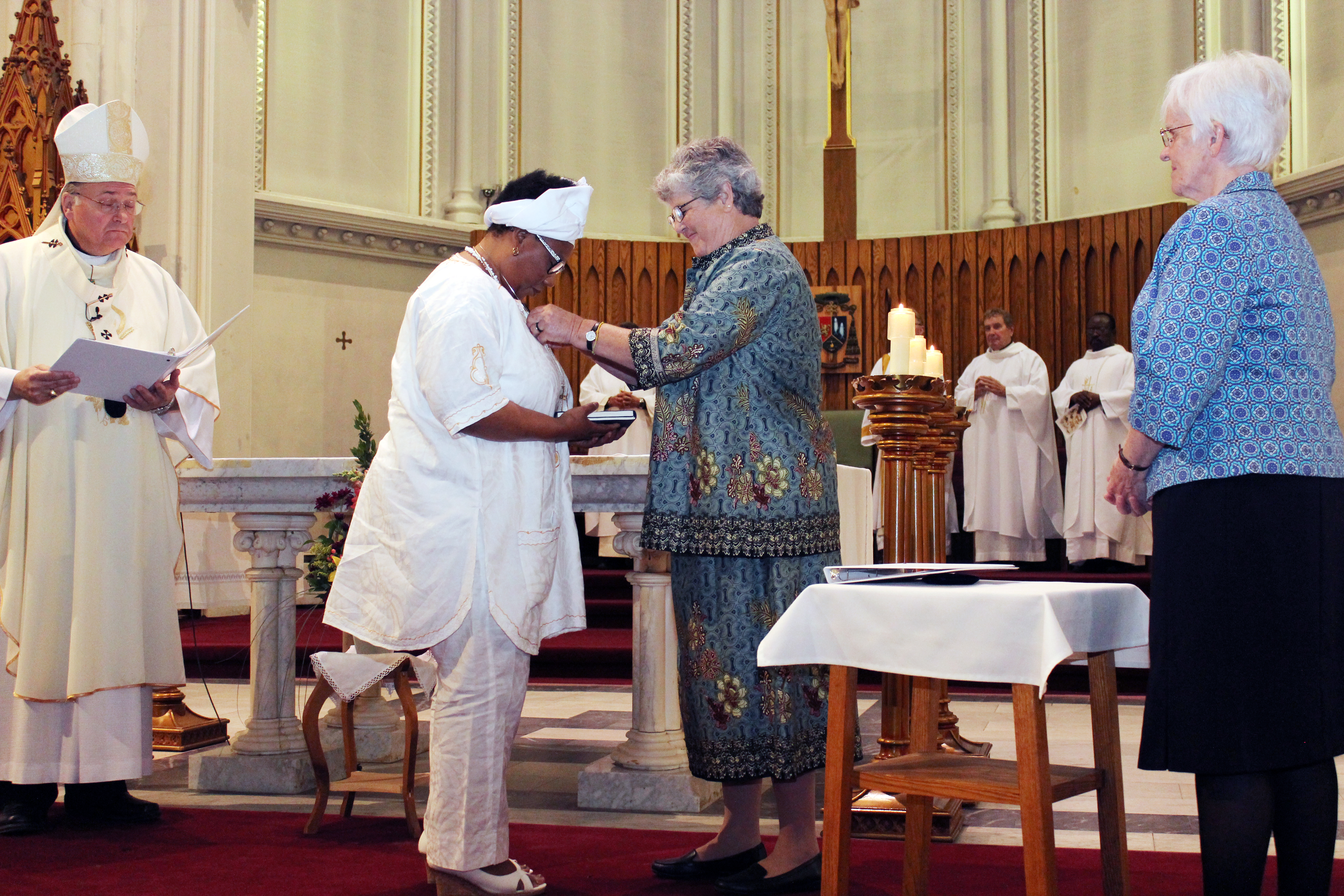 Sister Oluoha (left) at her first vows ceremony in 2016 with then Provincial Barbara Dawson, RSCJ (right)