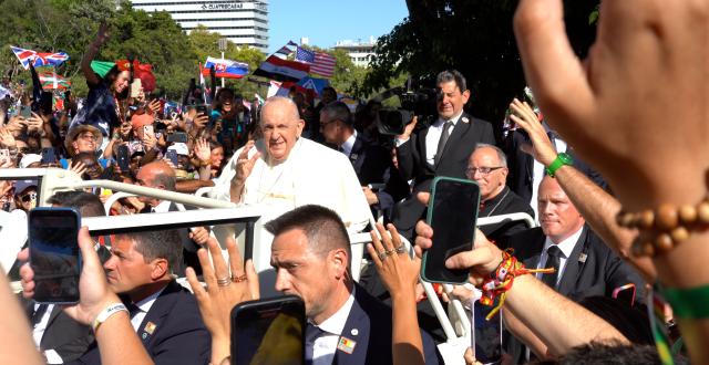 Pope Francis  waves to young people at the opening of World Youth Day 2023 in Lisbon, Portugal. (Photo by Erin Everson)
