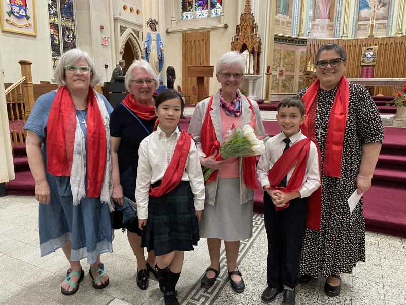 RSCJ with students at Anniversary Mass (Photo by Barb Martell)