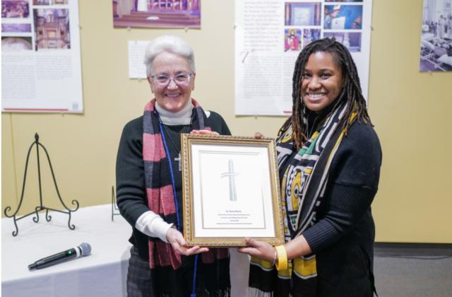 Diane Roche, RSCJ, receives the Father John O’Connor Award for Empowerment. (Photo by Catholic Charities )